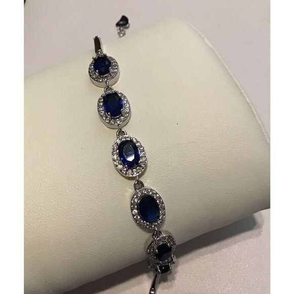 Gorgeous New 5 Ct. Oval Cut Blue & White Sapphire Halo Design Tennis Bracelet - Picture 3 of 3